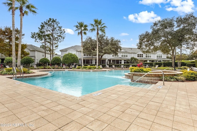 view of swimming pool with a patio area