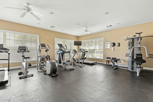 exercise room featuring a textured ceiling and ceiling fan