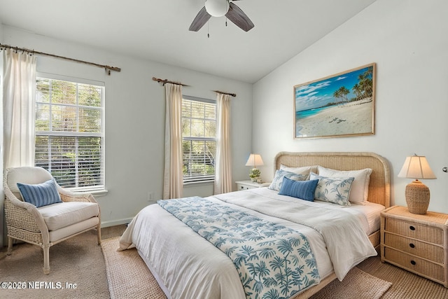 bedroom featuring vaulted ceiling, carpet floors, and ceiling fan