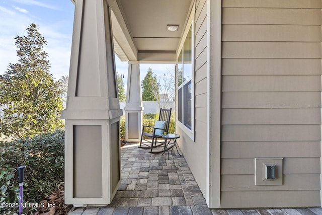 view of patio featuring a porch