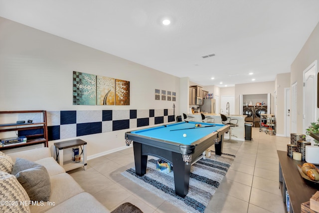 recreation room featuring independent washer and dryer, sink, billiards, and light tile patterned floors