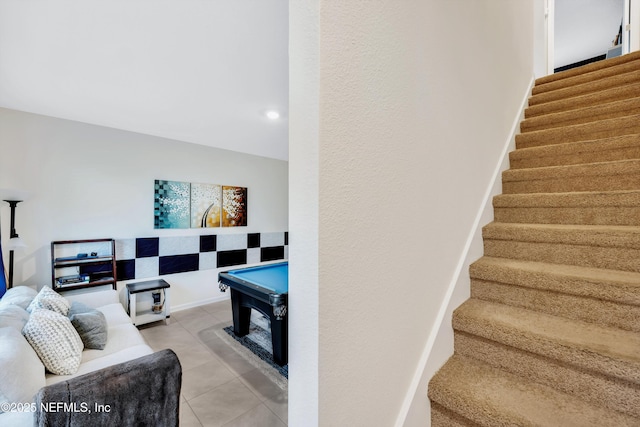 staircase featuring tile patterned floors