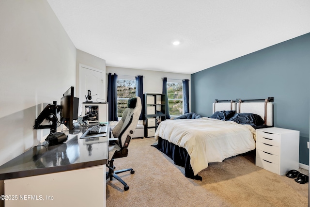 bedroom with light colored carpet