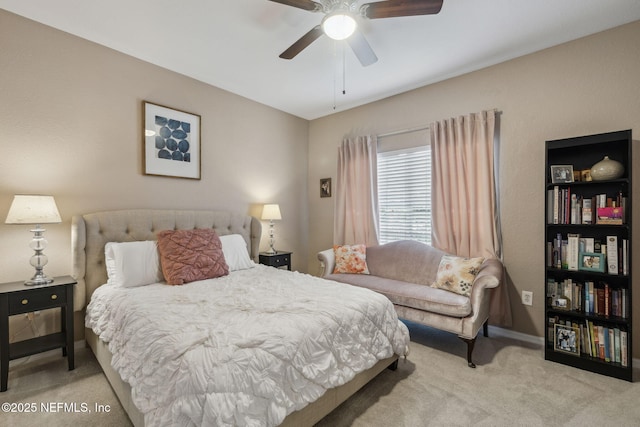 bedroom with light carpet and ceiling fan