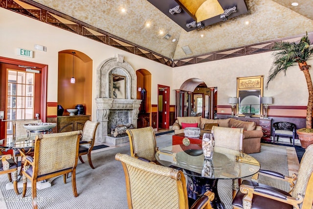 dining area featuring a high ceiling