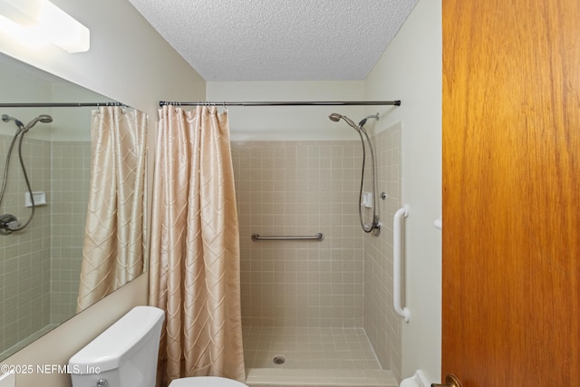 bathroom with walk in shower, toilet, and a textured ceiling