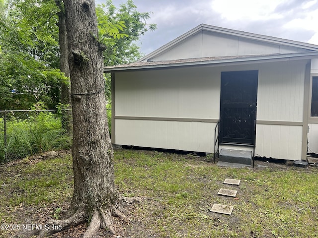 view of property exterior featuring fence