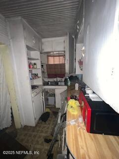 kitchen featuring white cabinets