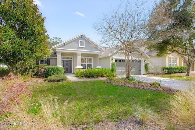 view of front facade with a garage and a front yard