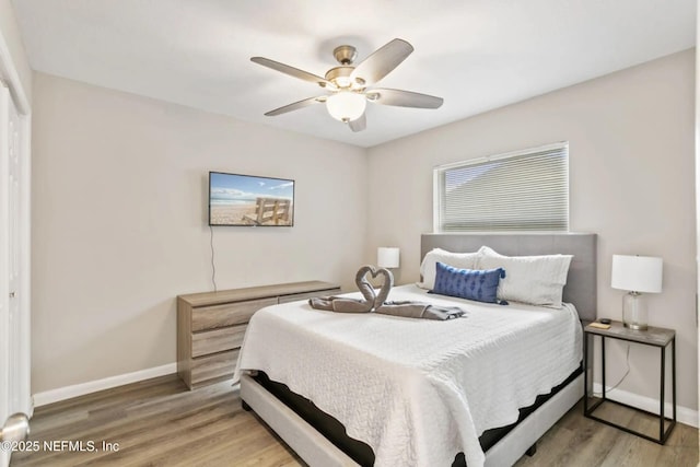 bedroom featuring hardwood / wood-style floors and ceiling fan