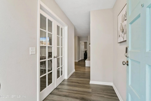 corridor featuring french doors and dark hardwood / wood-style floors