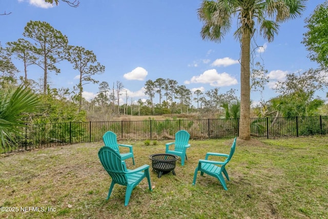 view of yard with a fire pit