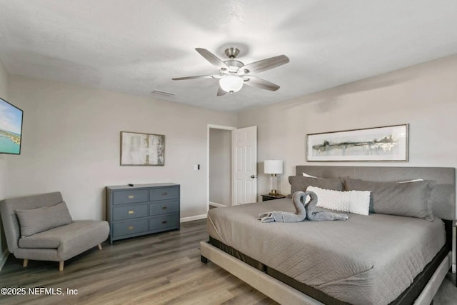 bedroom featuring ceiling fan and light hardwood / wood-style flooring