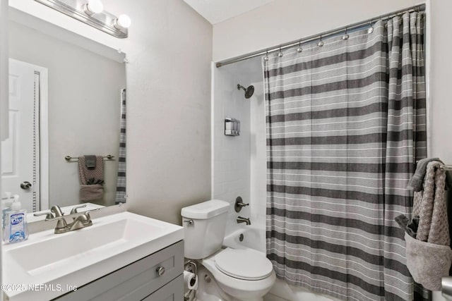 full bathroom featuring vanity, toilet, and shower / bath combo with shower curtain