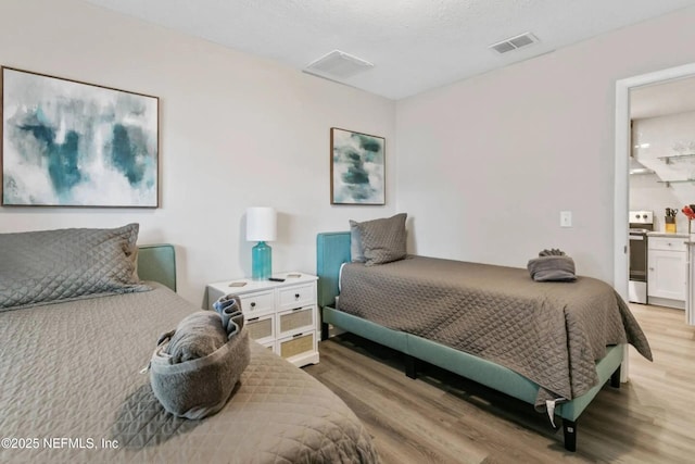 bedroom with light wood-type flooring