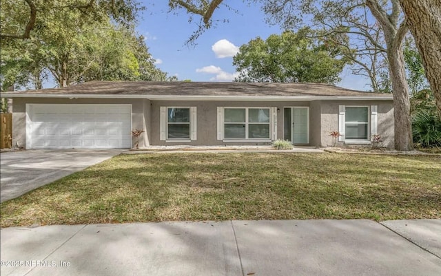 ranch-style home featuring a garage and a front yard