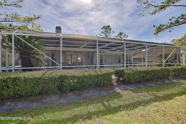 rear view of house with a lanai