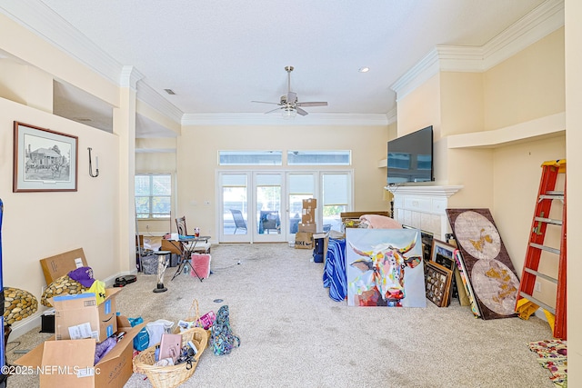 living room featuring ornamental molding, carpet floors, and ceiling fan