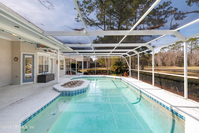 view of pool featuring a lanai and a patio area