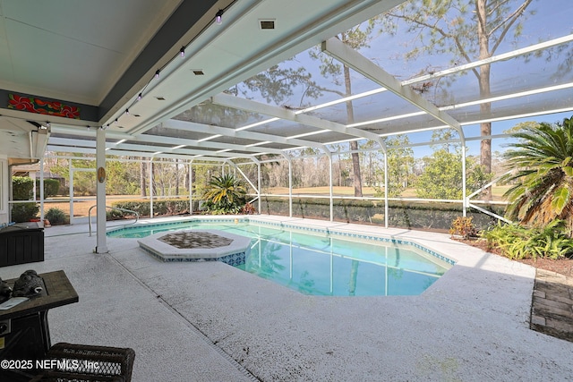 view of swimming pool with a patio and glass enclosure