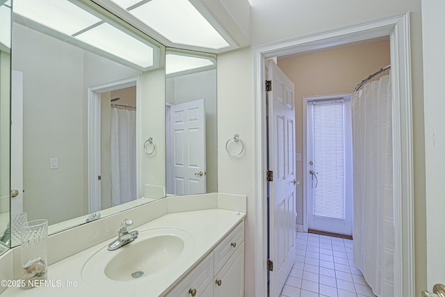 bathroom featuring tile patterned floors and vanity