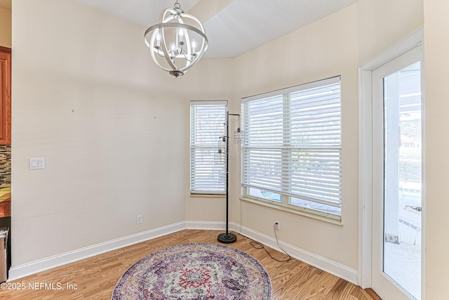 dining room with a notable chandelier and light hardwood / wood-style flooring