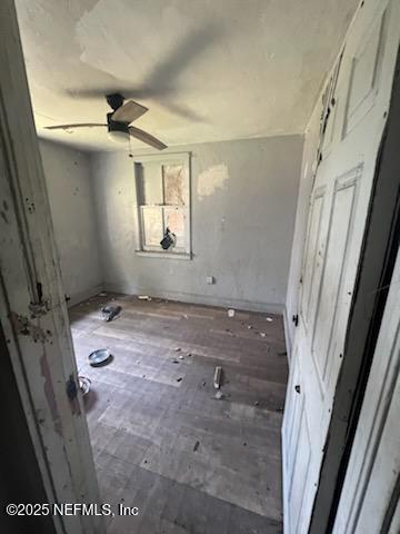 unfurnished bedroom with wood-type flooring