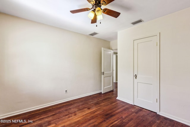 unfurnished bedroom featuring a ceiling fan, wood finished floors, visible vents, and baseboards