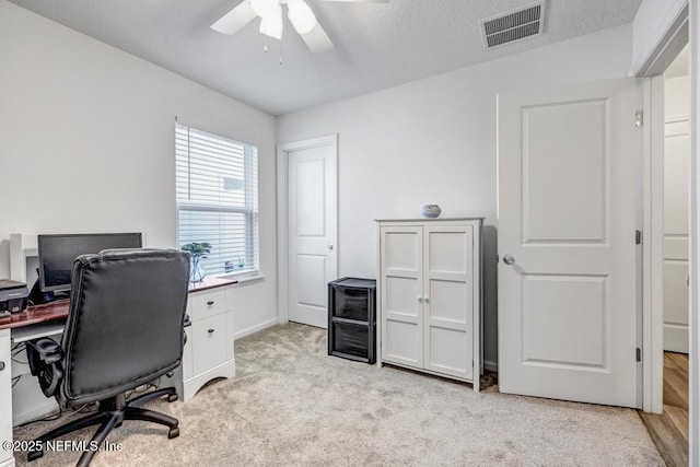 office featuring ceiling fan and light colored carpet