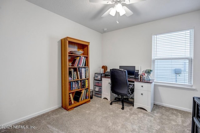 office with light colored carpet and ceiling fan