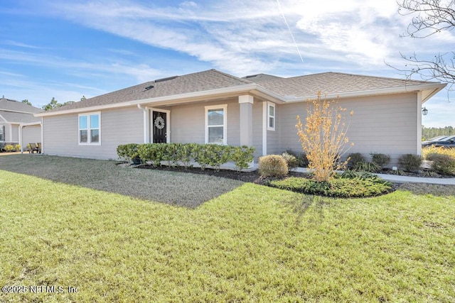 single story home featuring a front lawn