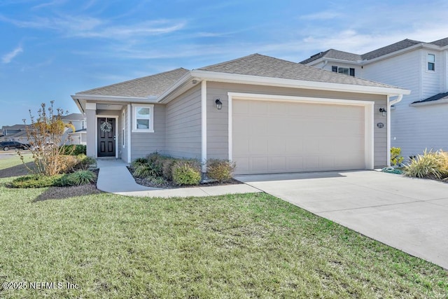 view of front facade featuring a garage and a front yard