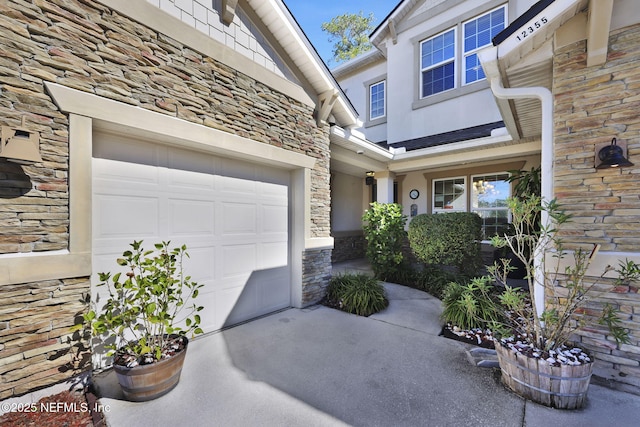 doorway to property featuring a garage