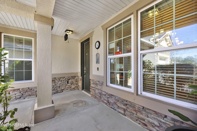 view of exterior entry featuring a porch