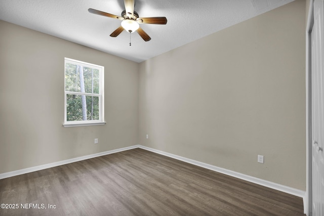 empty room featuring ceiling fan, hardwood / wood-style floors, and a textured ceiling