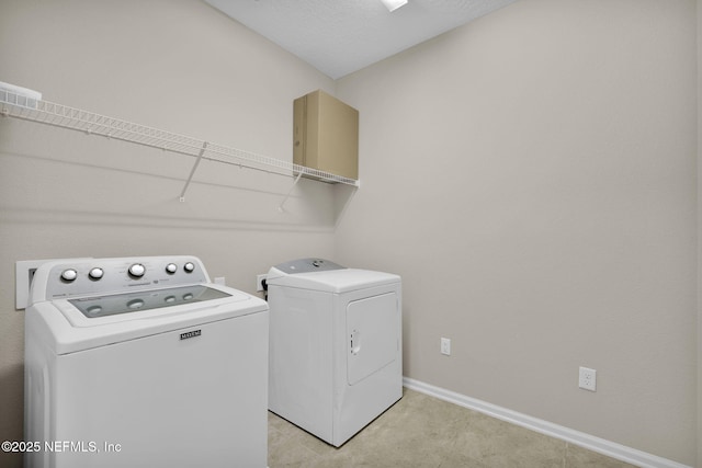 washroom featuring washer and dryer