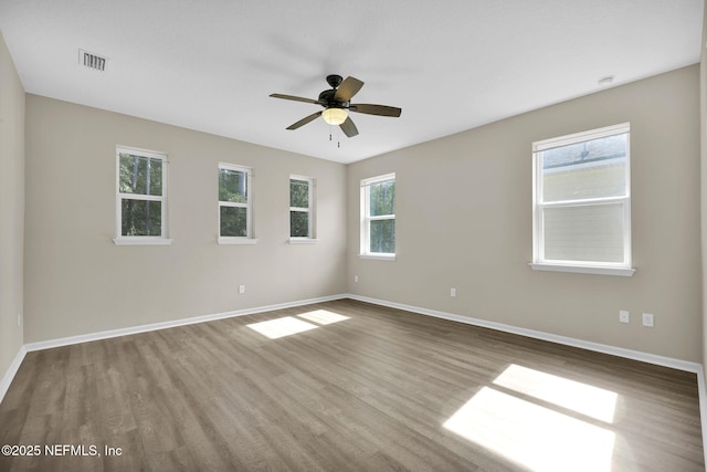 unfurnished room featuring hardwood / wood-style floors and ceiling fan