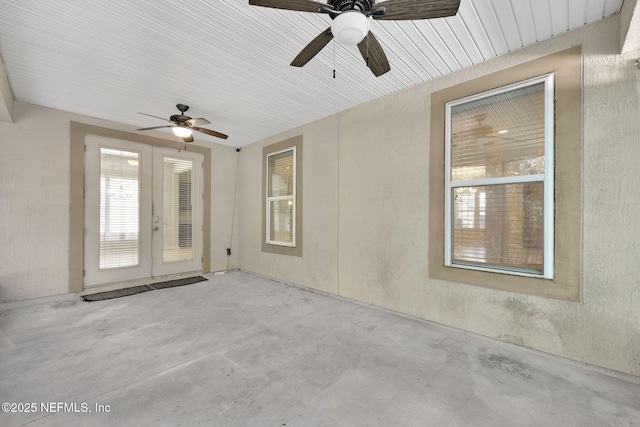 interior space featuring french doors and ceiling fan