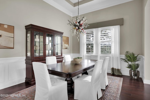 dining area with crown molding and dark hardwood / wood-style floors