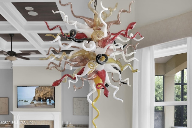 details featuring coffered ceiling, ceiling fan, ornamental molding, and beamed ceiling