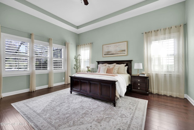 bedroom featuring ceiling fan and dark hardwood / wood-style flooring