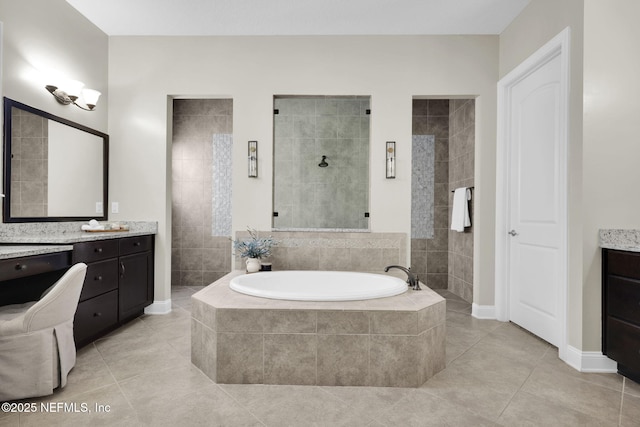 bathroom featuring vanity, tile patterned floors, and plus walk in shower