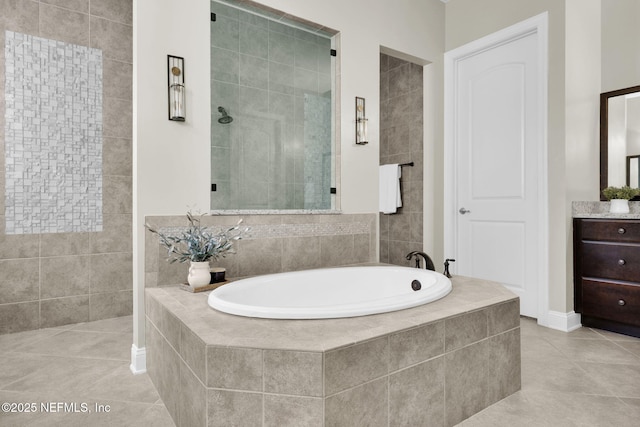 bathroom with tile patterned flooring and separate shower and tub