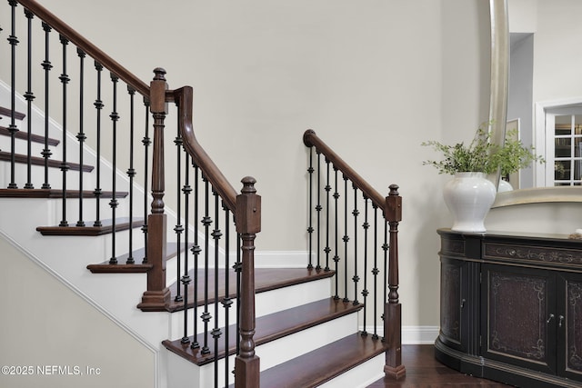 stairs with wood-type flooring