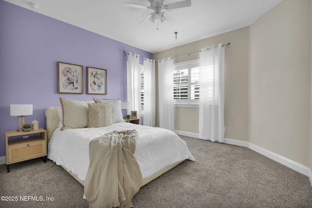 bedroom featuring ceiling fan and carpet