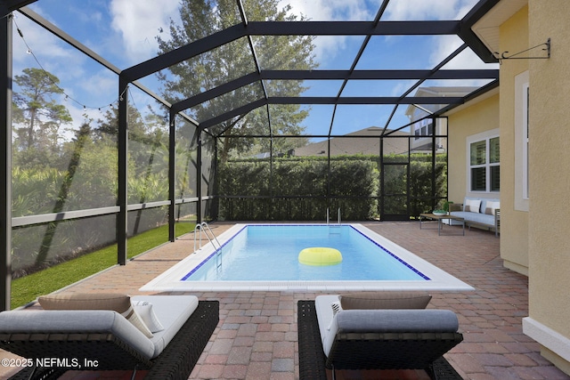 view of pool featuring a patio and glass enclosure