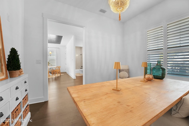 dining area with dark hardwood / wood-style flooring