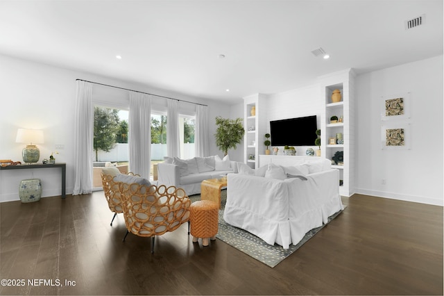 living room featuring dark wood-type flooring