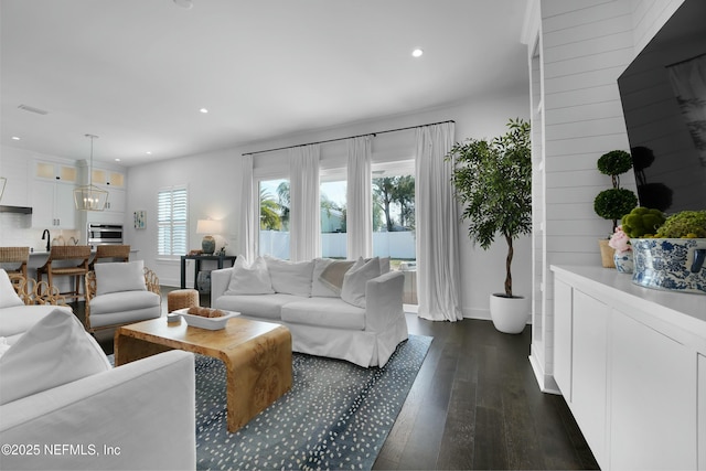 living room with dark hardwood / wood-style floors