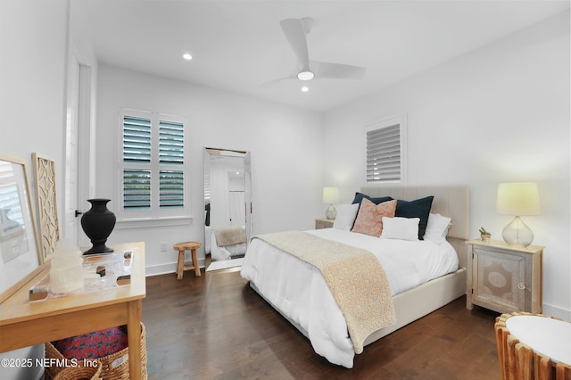 bedroom featuring ceiling fan and dark hardwood / wood-style flooring